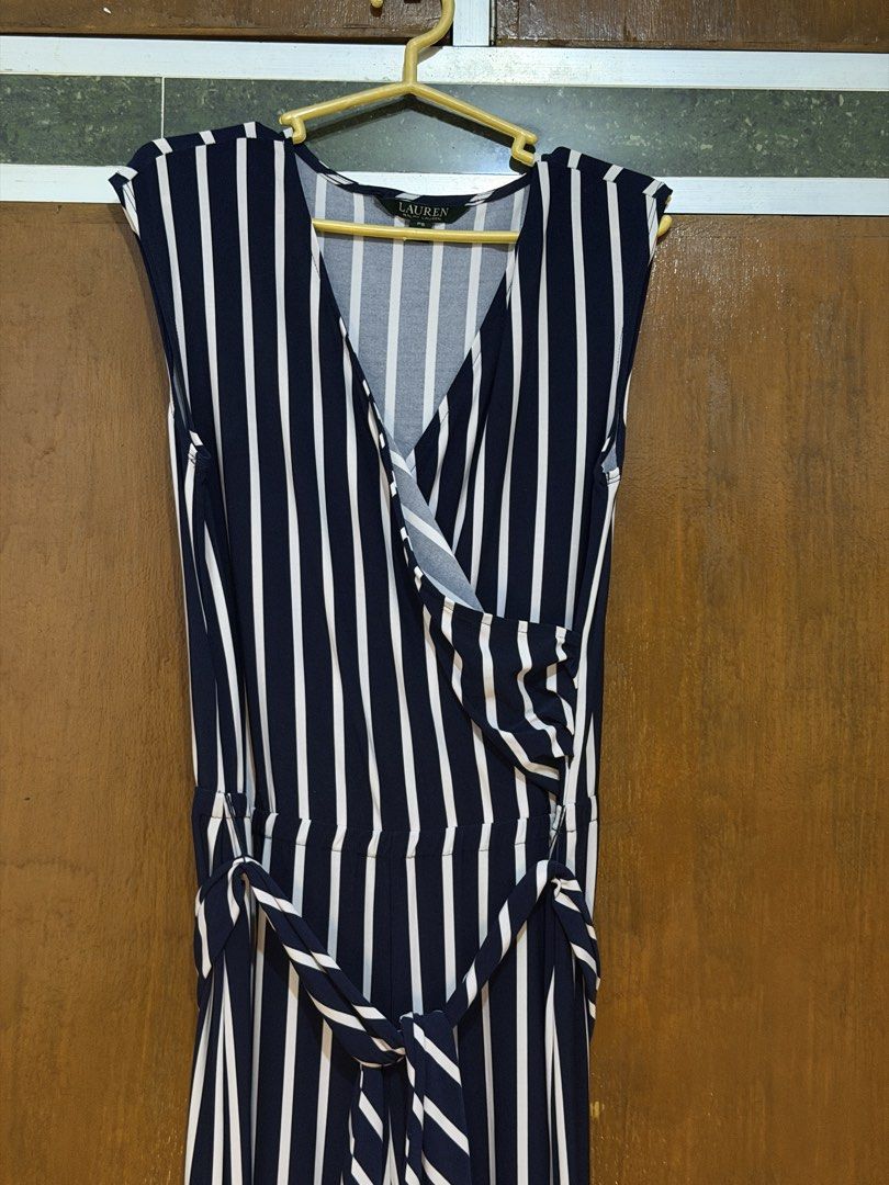 Ralph Lauren Navy Striped Jumpsuit (Category: Jumpsuits) located in Navotas City. Submitted by rahrahsevlau (Listing ID 1466172549, Image 3). Description: Ralph Lauren jumpsuit • PS (Petite Small) on tag but fits up to Large frames as fabric is super comfy stretchable! • Navy and white stripes (appears as black on photo but this is a beautiful navy blue) • Top feature a sleeveless, crossover v-neck neckline • Garterized waist with matching self-t