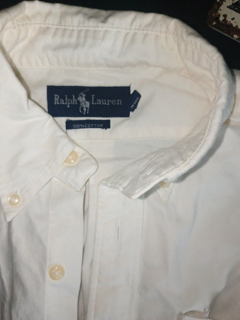 Ralph Lauren Short Sleeve Button Down Shirt White (Category: Tshirts & Polo Shirts ) located in Batangas. Submitted by mysticphoenix_c7726d (Listing ID 1466335648, Image 2). Description: - Brand: Ralph Lauren - Color: Classic White - Material: 100% Cotton (breathable & comfortable) - Fit: Regular fit - Details: Short sleeves, button-down closure, classic collar, single chest pocket with iconic embroidered polo player logo - Style: Perfect for cas