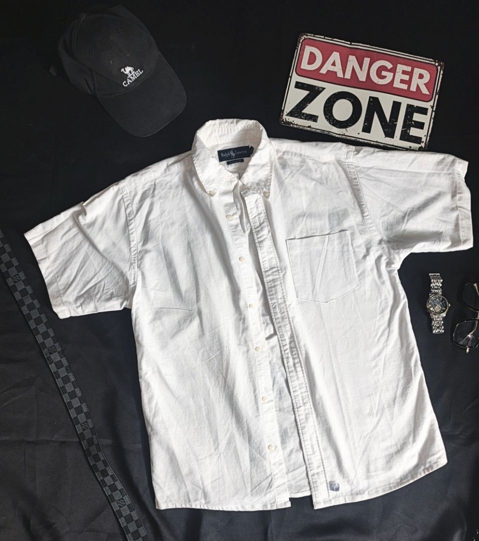 Ralph Lauren Short Sleeve Button Down Shirt White (Category: Tshirts & Polo Shirts ) located in Batangas. Submitted by mysticphoenix_c7726d (Listing ID 1466335648, Image 1). Description: - Brand: Ralph Lauren - Color: Classic White - Material: 100% Cotton (breathable & comfortable) - Fit: Regular fit - Details: Short sleeves, button-down closure, classic collar, single chest pocket with iconic embroidered polo player logo - Style: Perfect for cas