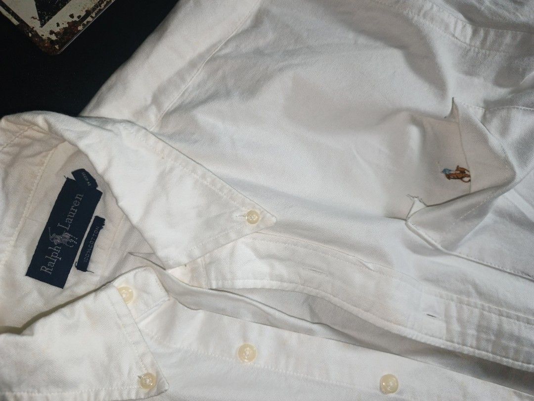 Ralph Lauren Short Sleeve Button Down Shirt White (Category: Tshirts & Polo Shirts ) located in Batangas. Submitted by mysticphoenix_c7726d (Listing ID 1466335648, Image 3). Description: - Brand: Ralph Lauren - Color: Classic White - Material: 100% Cotton (breathable & comfortable) - Fit: Regular fit - Details: Short sleeves, button-down closure, classic collar, single chest pocket with iconic embroidered polo player logo - Style: Perfect for cas