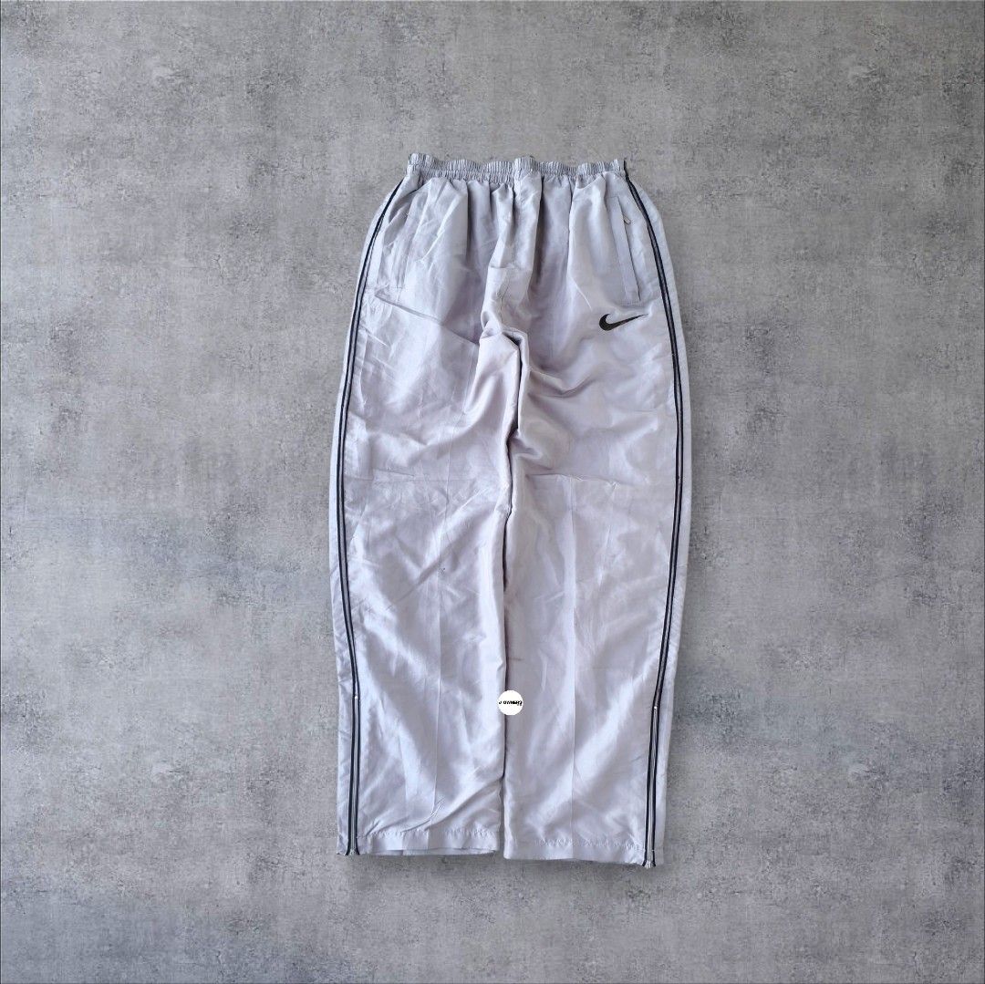 Rare Nike Trackpants Embroidered (Category: Activewear) located in Pasig City. Submitted by j.ownerss (Listing ID 1466300450, Image 2). Description: FOR SALE‼️ RARE NIKE TRACKPANTS‼️ ₱700 ONLY Logo Embroidered 3 pockets Double lining With ankle zip Condition: 9/10 Flaws: cut tags, loose stitching and very minimal pinhole (unnoticeable, refer to last 2 slides) Waistline: 20-38 Length: 40 Hem: 8 Pickup: Allegra Garden Place Pasig Delivery via Lalam