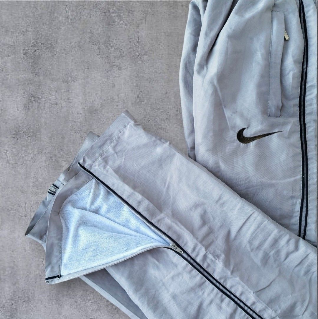 Rare Nike Trackpants Embroidered (Category: Activewear) located in Pasig City. Submitted by j.ownerss (Listing ID 1466300450, Image 3). Description: FOR SALE‼️ RARE NIKE TRACKPANTS‼️ ₱700 ONLY Logo Embroidered 3 pockets Double lining With ankle zip Condition: 9/10 Flaws: cut tags, loose stitching and very minimal pinhole (unnoticeable, refer to last 2 slides) Waistline: 20-38 Length: 40 Hem: 8 Pickup: Allegra Garden Place Pasig Delivery via Lalam