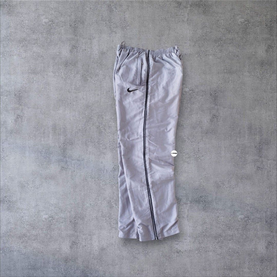 Rare Nike Trackpants Embroidered (Category: Activewear) located in Pasig City. Submitted by j.ownerss (Listing ID 1466300450, Image 1). Description: FOR SALE‼️ RARE NIKE TRACKPANTS‼️ ₱700 ONLY Logo Embroidered 3 pockets Double lining With ankle zip Condition: 9/10 Flaws: cut tags, loose stitching and very minimal pinhole (unnoticeable, refer to last 2 slides) Waistline: 20-38 Length: 40 Hem: 8 Pickup: Allegra Garden Place Pasig Delivery via Lalam