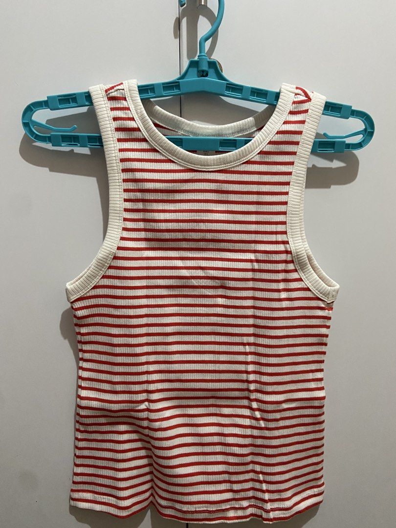 Red and White Striped Ribbed Tank Top (Category: Sleeveless) located in Manila. Submitted by grandwhale.e87eca (Listing ID 1466221084, Image 1). Description: - Color/Pattern: Red and white striped - Fit & Fabric: Fitted cut in a soft, stretchy ribbed knit - Neckline: Classic crew neck - Style: Versatile basic for layering or wearing solo - Condition: Clean, flawless, excellent pre-loved condition.