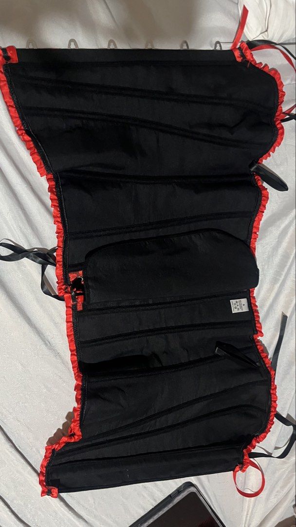 Red Corset With Black Ruffles Size S (Category: Sleeveless) located in Manila. Submitted by natalierenee.baltazar-38452 (Listing ID 1466190578, Image 3). Description: - Size: Small - Color/Pattern: Red and black with detailed damask design - Material: 90% polyester, 10% spandex (hand wash only) - Closure: Front metal busk with secure clasps - Fit: Traditional black ribbon lace-up back for custom adjustment - Style Details: Ruffled trim along top 