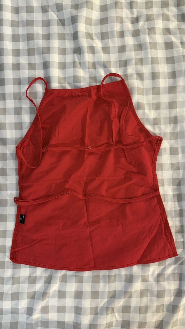 Red Halter Tank Top Size XS (Category: Sleeveless) located in Muntinlupa City. Submitted by addielejano (Listing ID 1466267207, Image 2). Description: - Color: Bright red - Size: XS (tag on side seam) - Style: Halter tank top with thin back straps, sleeveless, straight hem - Versatile: Easy to style with jeans or shorts.