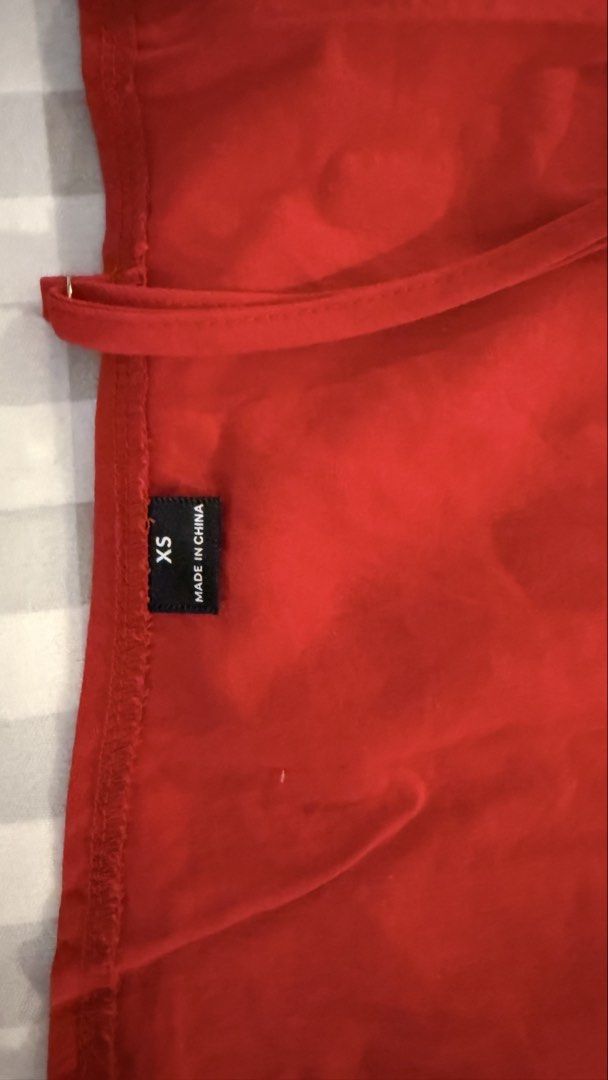 Red Halter Tank Top Size XS (Category: Sleeveless) located in Muntinlupa City. Submitted by addielejano (Listing ID 1466267207, Image 3). Description: - Color: Bright red - Size: XS (tag on side seam) - Style: Halter tank top with thin back straps, sleeveless, straight hem - Versatile: Easy to style with jeans or shorts.