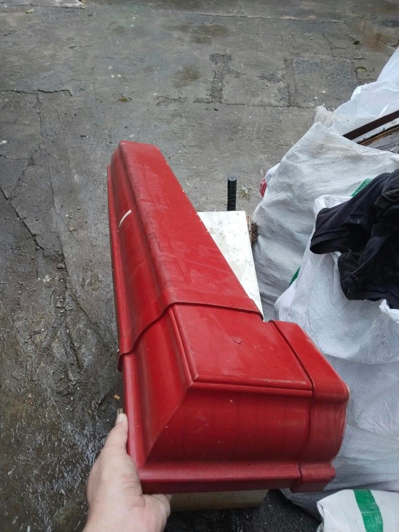 Red plastic roof gutter drainage channel (Category: Construction & Building Materials) located in Caloocan City. Submitted by butterflycarnival2026 (Listing ID 1466244780, Image 1). Description: - Long red plastic roof gutter channels - Classic shape featuring a finished end cap detail - Bright red colour throughout for a bold look - Sturdy construction designed for reliable rainwater drainage - Leftover extras from a completed roofing project - 