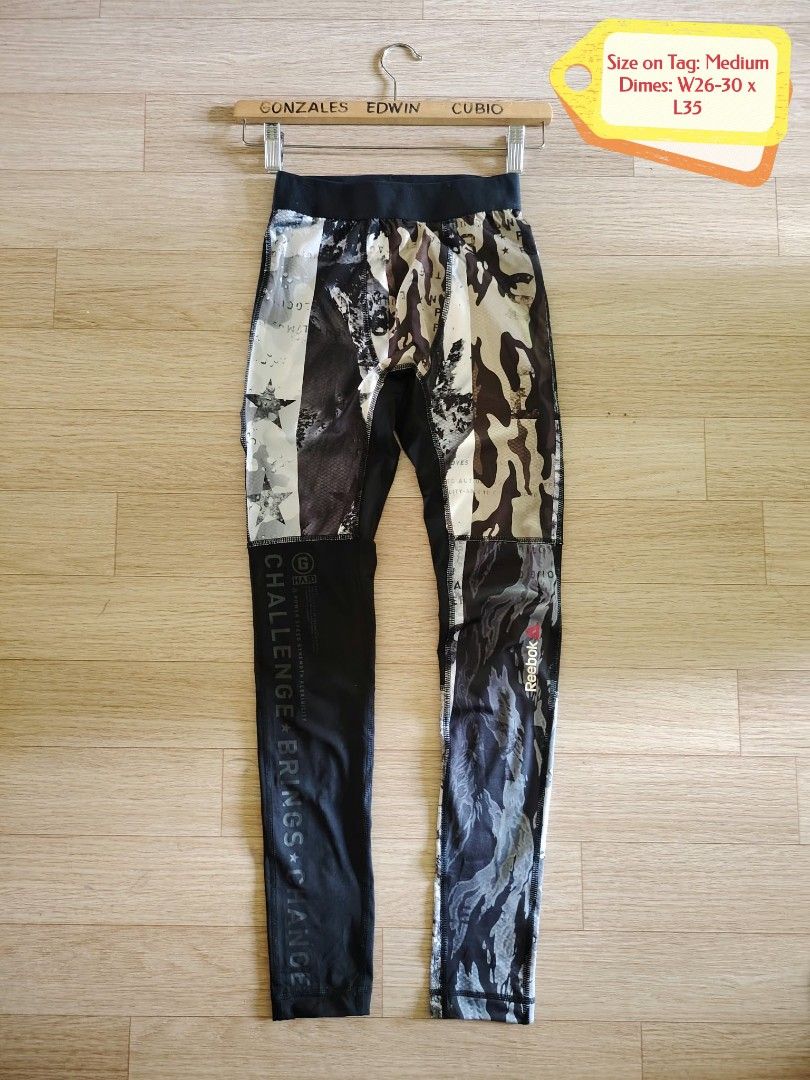 Reebok Camo Performance Tights Leggings Size M (Category: Activewear) located in Nasipit. Submitted by edwingonzales498-69377 (Listing ID 1466232270, Image 2). Description: - Brand: Reebok - Style: Performance tights with mixed camo and star print - Size: Medium (Waist: 26"–30", Length: 35") - Material: 88% Polyester, 12% Elastane with Speedwick technology - Features: Elastic waistband, tight fit for ultimate workout support - Condition: Excellen