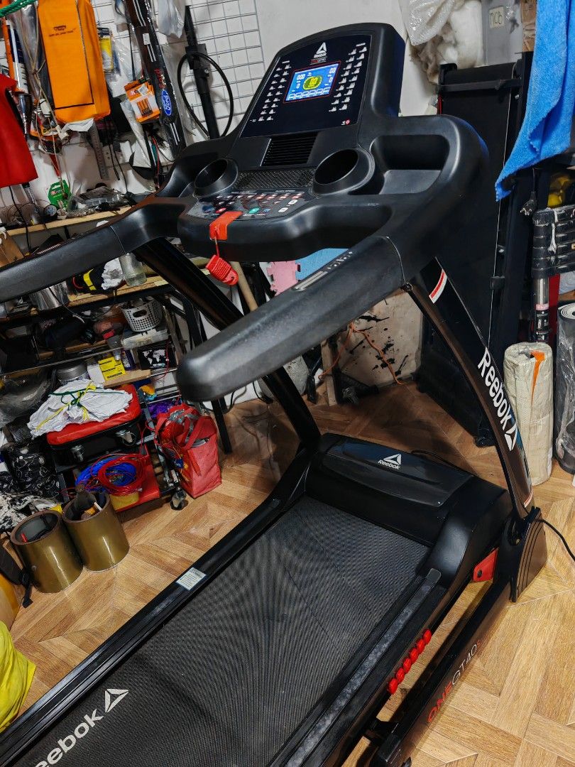 Reebok One GT40s Treadmill (Category: Cardio & Fitness Machines) located in Bacoor. Submitted by richie.olarte091479 (Listing ID 1466326964, Image 3). Description: Reebok One GT40s Motorized Treadmill - Digital console tracks speed, distance, and time - Quick incline and speed buttons for easy adjustments - Built-in cup holders and safety key included - Sturdy black frame with stylish red accents - Ideal for home workouts and daily cardio - Pick 