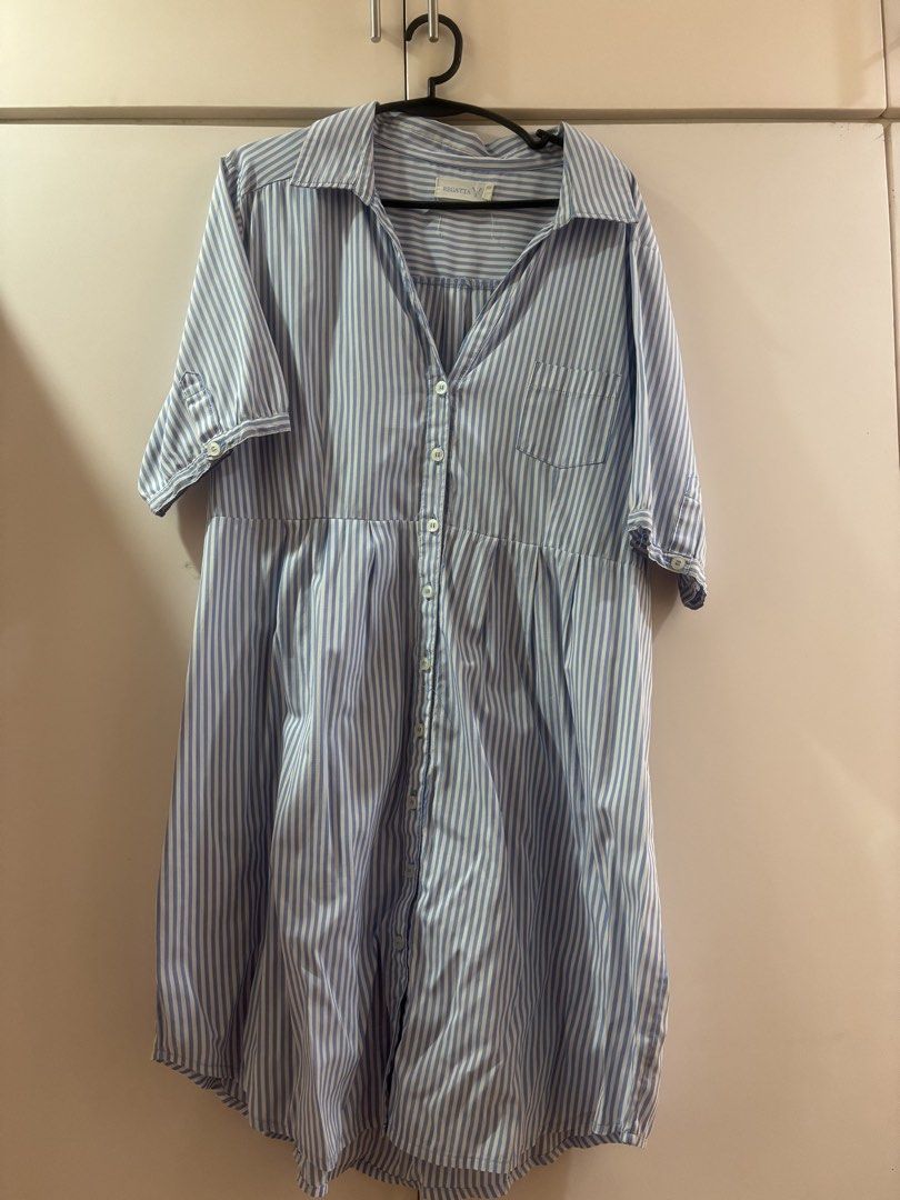 Regatta Blue Striped Button Down Shirt Dress (Category: Dresses) located in Las Pinas. Submitted by misg0905 (Listing ID 1466243166, Image 1). Description: - Brand: Regatta - Design: Blue and white striped button-down dress - Sleeves: Short sleeves with convenient roll-up tabs - Details: Classic collared neck, front chest pocket, and full front button closure - Style: Dropped waist with a cute gathered skirt detail - Material: Lightweight and sup