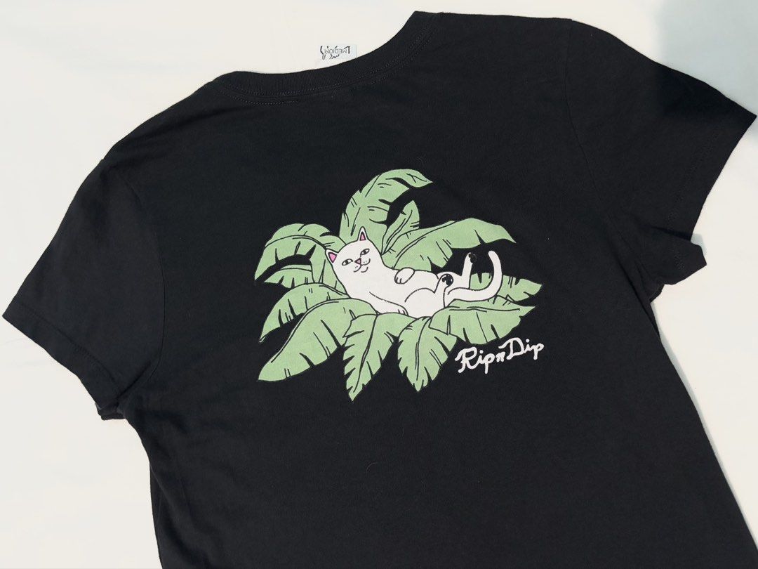 RIPNDIP PALM TREE T-Shirt for Womens (Category: Shirts) located in Manila. Submitted by tindero_ng_ano (Listing ID 1466192983, Image 3). Description: RIPNDIP PALM TREE T-Shirt for Womens -Condition: Used like new -Size on Tag: Medium US Womens -Dimensions: -Pit-to-Pit Width: 18” -Shoulder Width: 16” -Length: 27” -Sleeve Length: 9.5” -Color Rate: 9/10 -Rfs: decluttering -Price: ₱350.