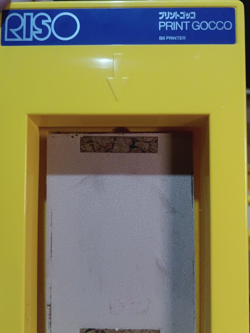 Riso Print Gocco B6 Set Printer (Category: Printers, Scanners & Copiers) located in Manila. Submitted by naneropane48426 (Listing ID 1466276586, Image 3). Description: Complete Riso Print Gocco B6 set in original box. Includes yellow printer unit, unopened box of 10 lamps, three tubes of print ink, instruction manual, postcard drawing papers, and the 1987 New Year illustration book. Yellow storage box has some vintage wear on the outside..