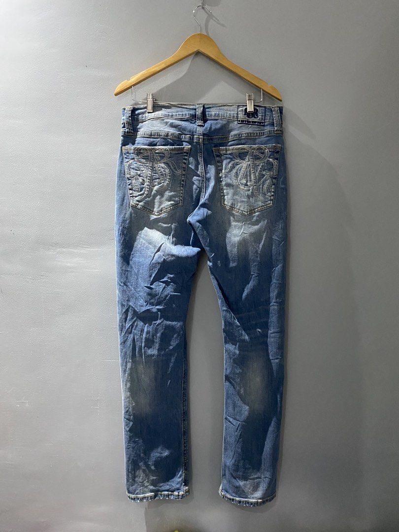 Rock & Republic Slim Straight Jeans (Category: Jeans) located in Bangued. Submitted by koroysthrifts (Listing ID 1466296039, Image 3). Description: - Brand: Rock & Republic 34-36x41x8 - Style: Slim straight jeans - Color/Wash: Medium blue with stylish faded whiskering - Details: Iconic embroidered R logo on back pockets, branded metal hardware, and contrast stitching - Fit: Comfortable denim fabric with a classic 5-pocket design.