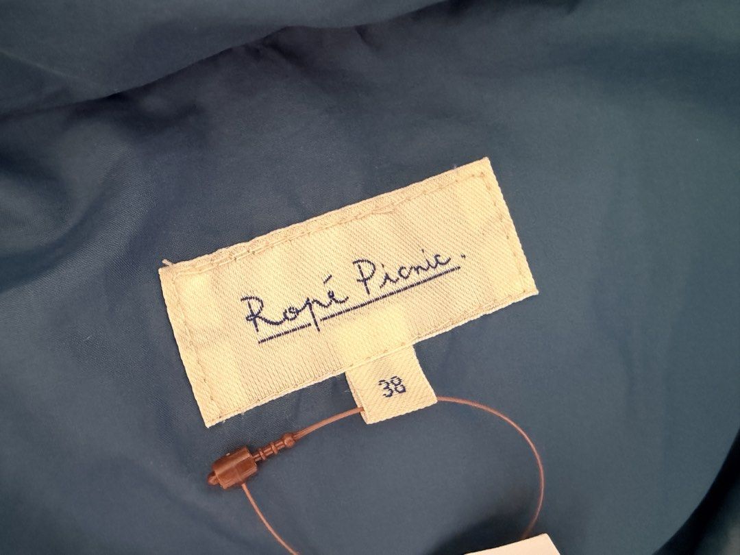 Rope Picnic Puffer Jacket Dark Green Size 38 (Category: Coats, Jackets and Outerwear) located in Quezon City. Submitted by makingroomfinds (Listing ID 1466182062, Image 3). Description: - Brand: Rope Picnic - Color: Dark Green - Size: 38 (Medium) - Condition: Brand new with original tag attached - Features: Attached hood with brown faux fur trim, quilted design, secure front zipper and button closure - Perfect for: Cold weather and winter travels