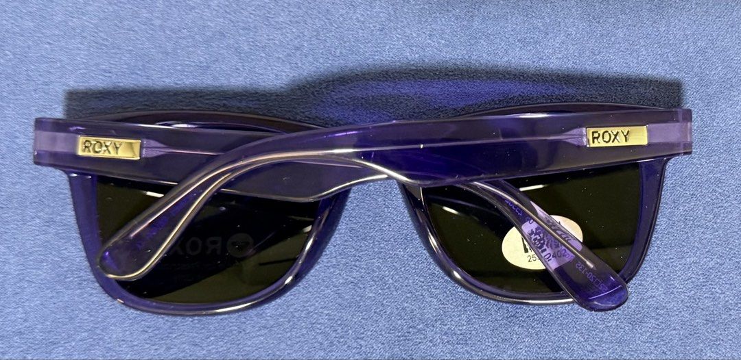 ROXY Purple Prescription Ready Sunglasses (Category: Sunglasses & Eyewear) located in Dasmarinas. Submitted by toyang50 (Listing ID 1466204757, Image 2). Description: Brand new ROXY purple frame sunglasses with original lens stickers intact. Features gold ROXY logo plates on the temples and demo lenses suitable for prescription use. Never worn!.