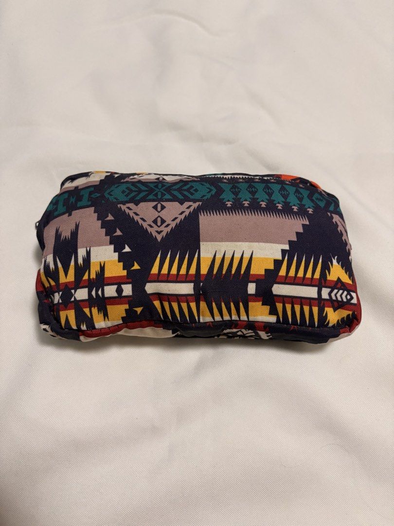 Roxy x Pendleton Convertible Backpack Tote Bag (Category: Backpacks) located in Mandaluyong City. Submitted by sarisaringtinda (Listing ID 1466321994, Image 3). Description: - Authentic Roxy x Pendleton collaboration - Eye-catching geometric southwest pattern in navy, orange, yellow, and teal - Convertible design: wear as a backpack or carry as a tote - Packable design: folds into its own built-in front zip pocket into a compact pouch - Drawstrin