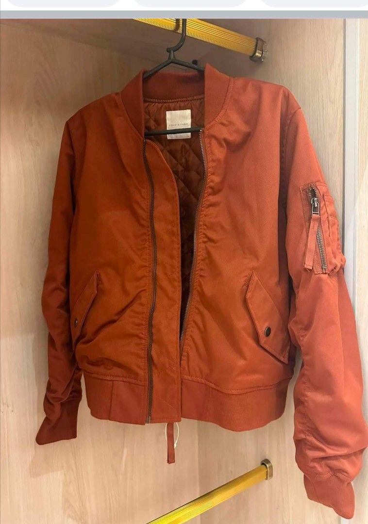 Rust Orange Bomber Jacket Quilted Lining (Category: Coats, Jackets and Outerwear) located in Manila. Submitted by aaliyahsa58389 (Listing ID 1466198347, Image 1). Description: - Color: Warm rust orange - Lining: Quilted inner lining for extra warmth - Pockets: Convenient side pockets and utility zipper pocket on the sleeve - Closure: Smooth front zipper - Fit/Details: Ribbed cuffs and hem to block the wind - Style: Great for autumn, easy to throw