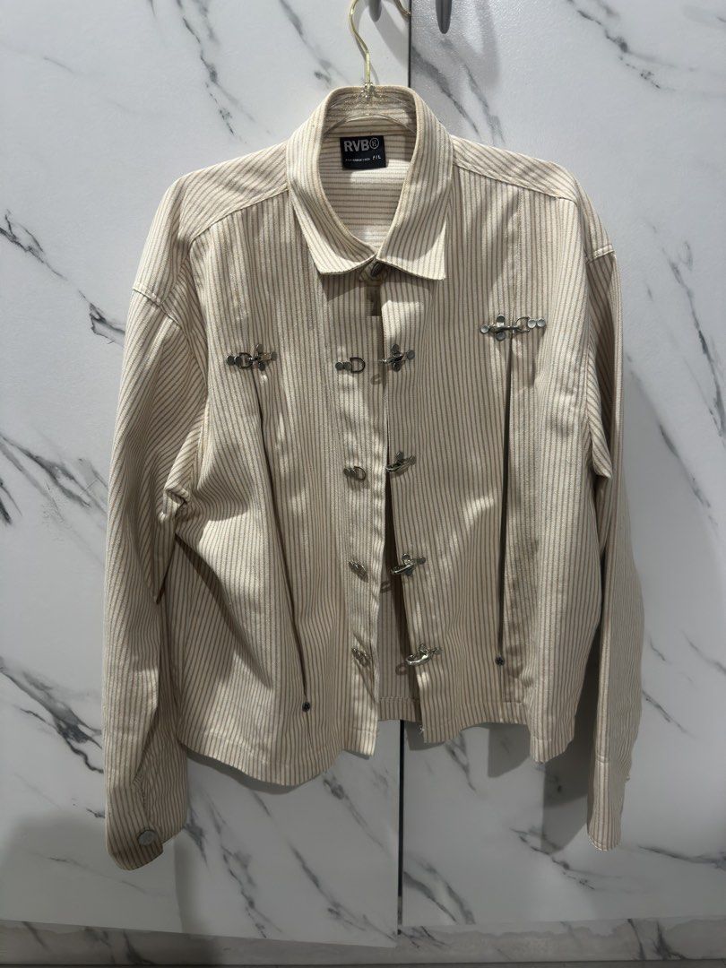 RVB Striped Chinese Inspired Yellow Jacket (Category: Coats, Jackets and Outerwear) located in Baguio. Submitted by miss_misery (Listing ID 1466255386, Image 1). Description: - Brand: RVB (Tags attached) - Made in Vietnam - Color/Pattern: Beige and white stripes - Design: Collared neckline, button-up front, unique metal chest clasp, and leather back patch - Sleeves: Long sleeves with button cuffs - Fit: Relaxed fit, ideal for layering during tran