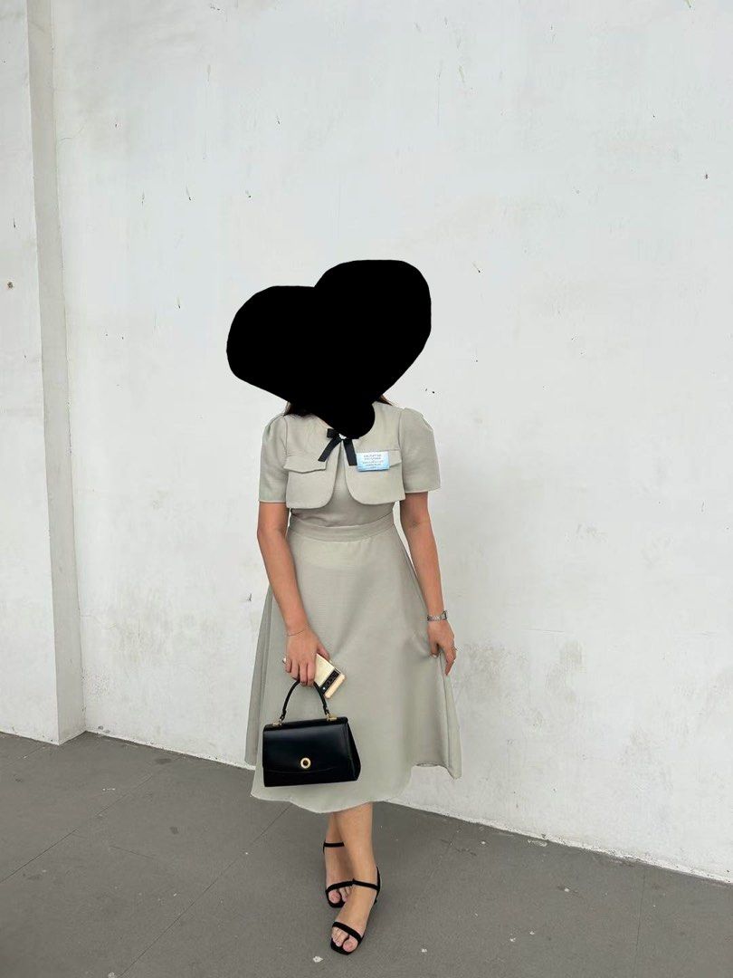 Sage Green Midi Dress with Black Bow Accent (Category: Dresses) located in Quezon. Submitted by cjstaana08 (Listing ID 1466242536, Image 3). Description: - Color: Sage green - Size: L (refer to product chart photo for exact measurements) - Style: Midi dress with matching cropped top overlay - Details: Black ribbon bow with crystal brooch center at the neckline - Fit & Fabric: Regular fit, flared skirt hitting mid-calf, zero stretch - Condition: B
