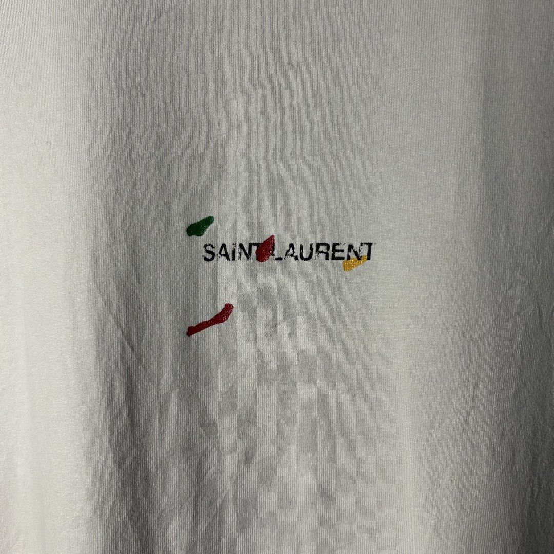 Saint Laurent Paris - Rive Gauche “Painter” T-shirt (Category: Luxury Apparel) located in Tayabas. Submitted by streetdepartment (Listing ID 1466311234, Image 3). Description: Saint Laurent Paris - Rive Gauche “Painter” T-shirt Excellent condition Flaw/s: loose stitch on neck tag Size: Small fits Large Measurements (inches): Width: 22.5” Length: 28.5” Price: 1,680 + shipping fee Dm to purchase! Note: Manage your expectations as you are dealing wi