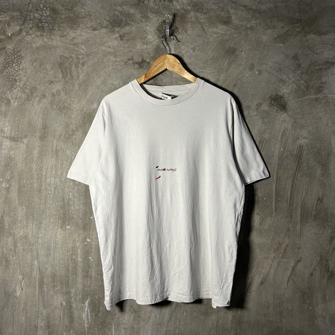 Saint Laurent Paris - Rive Gauche “Painter” T-shirt (Category: Luxury Apparel) located in Tayabas. Submitted by streetdepartment (Listing ID 1466311234, Image 1). Description: Saint Laurent Paris - Rive Gauche “Painter” T-shirt Excellent condition Flaw/s: loose stitch on neck tag Size: Small fits Large Measurements (inches): Width: 22.5” Length: 28.5” Price: 1,680 + shipping fee Dm to purchase! Note: Manage your expectations as you are dealing wi