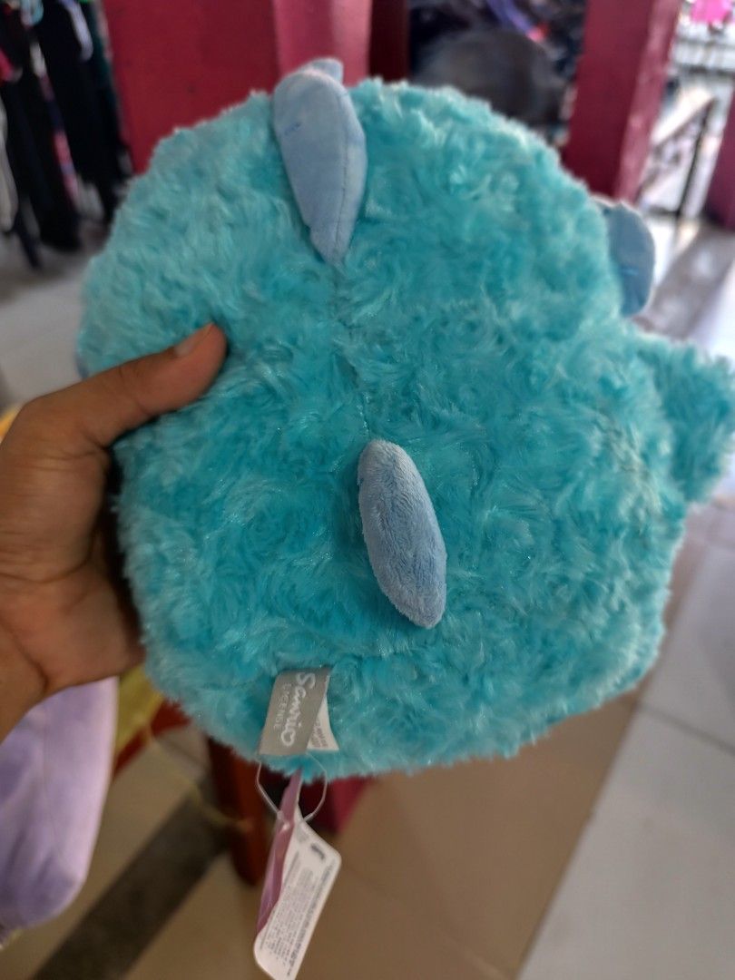 Sanrio Hangyodon fluffy blue plush toy (Category: Plushies & Soft Toys) located in Cordova. Submitted by bsb.streetluxvintage.clothing (Listing ID 1466179966, Image 2). Description: - 100% Authentic Sanrio Hangyodon plushie in bright blue - Super soft, furry texture with cute pink lips - Detailed embroidered scales, side fins, and back spikes - Original tag attached with official Sanrio license label - Perfect for Sanrio collectors and gift-givin