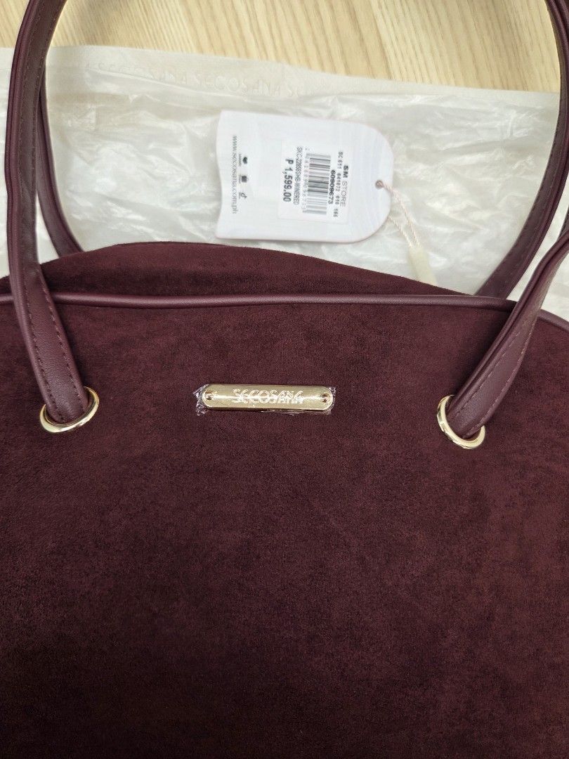 Secosana Aluna Wine Red Shoulder Bag (Category: Shoulder Bags) located in Manila. Submitted by ibnrssa (Listing ID 1466193106, Image 2). Description: SECOSANA Aluna Suede Shoulder Bag Wine red suede Thin twin shoulder straps Original Price: 1,599 Selling for: 999 (discounted at 899 for 10.10) never been used dust bag included can do shipping, buyer will shoulder sf payo if meet up, around Makati.