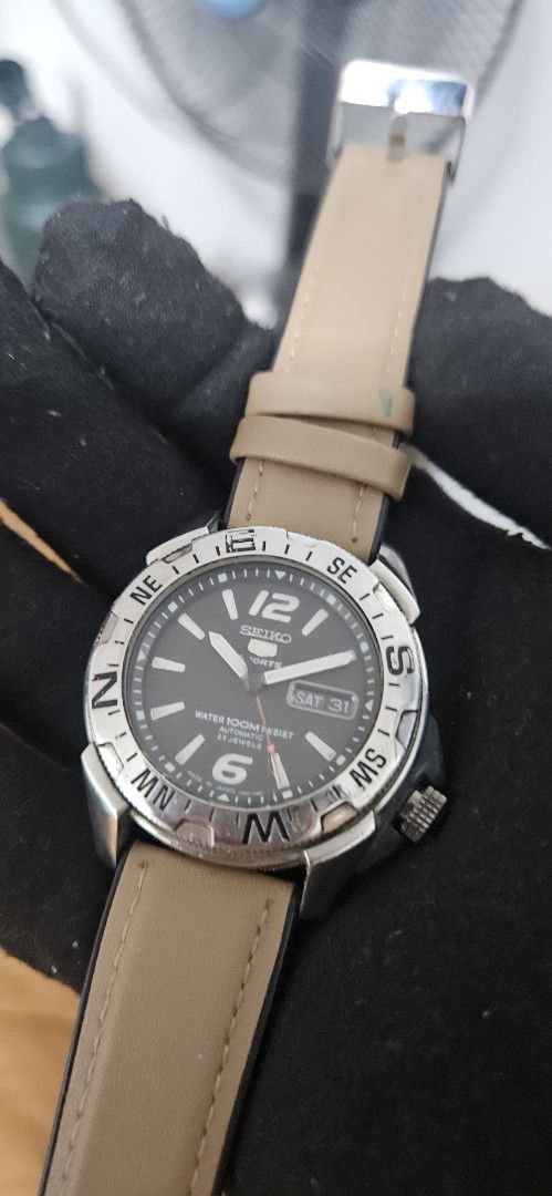 Seiko 5 Sports Automatic Compass Bezel Watch (Category: Men's Watches) located in Santa Maria. Submitted by rommelmateo (Listing ID 1466309057, Image 1). Description: - Authentic Seiko 5 Sports automatic watch with 7S36 movement (23 jewels) - Bold black dial with large 6 and 12 markers and 3 o'clock day-date display - Rotating compass bezel with cardinal directions - 100m water resistance for everyday durability - Unique 4 o'clock signed crown pl