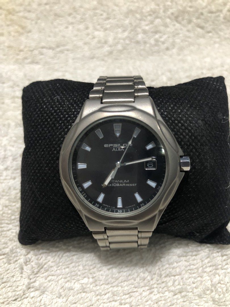 Seiko Alba Epsilon Solar Watch (Category: Men's Watches) located in Binmaley. Submitted by alex123345 (Listing ID 1466315682, Image 3). Description: - Seiko Epsilon Alba Titanium Brand: Alba (Sub-brand of Seiko) Model: Epsilon Alba Titanium Reference: V145-0E60 Watch Movement: Seiko Caliber V145 Solar Quartz Power Source: Solar Powered / Light-driven Dial Details: Black Dial, Date Window Case and Bezel: Titanium Water Resistance: 10 Bar (100 Mete