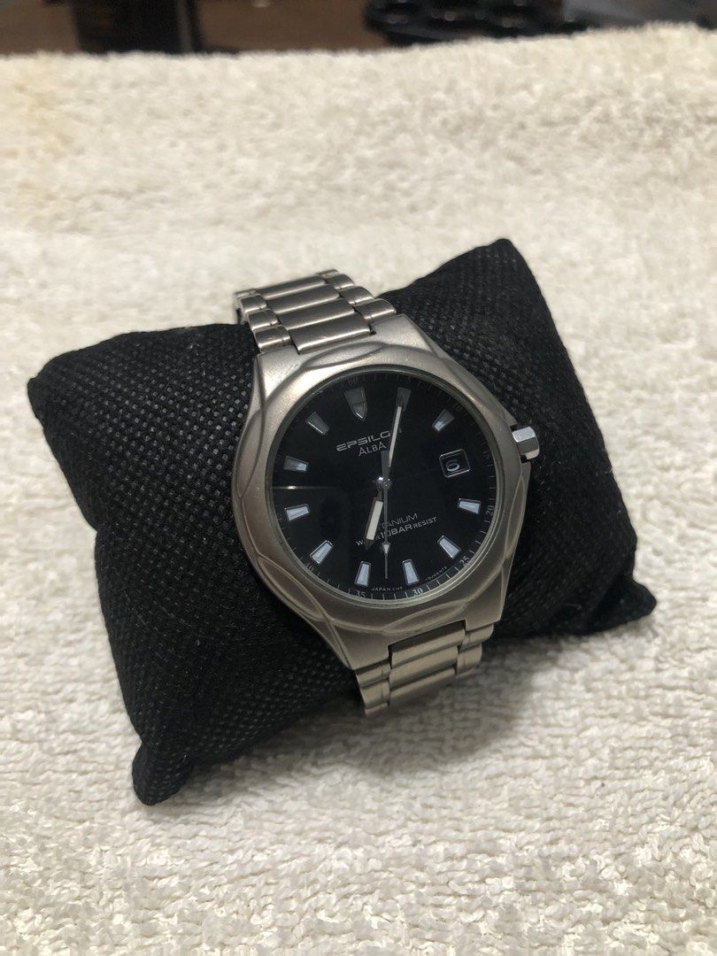 Seiko Alba Epsilon Solar Watch (Category: Men's Watches) located in Binmaley. Submitted by alex123345 (Listing ID 1466315682, Image 2). Description: - Seiko Epsilon Alba Titanium Brand: Alba (Sub-brand of Seiko) Model: Epsilon Alba Titanium Reference: V145-0E60 Watch Movement: Seiko Caliber V145 Solar Quartz Power Source: Solar Powered / Light-driven Dial Details: Black Dial, Date Window Case and Bezel: Titanium Water Resistance: 10 Bar (100 Mete