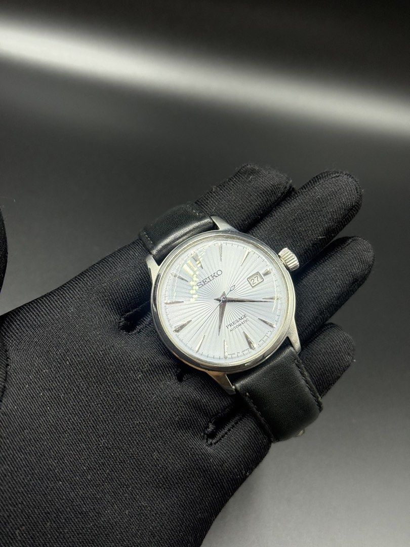 Seiko Presage Cocktail Time Automatic Watch (Category: Men's Watches) located in Manila. Submitted by cws.ph (Listing ID 1466250823, Image 1). Description: - Brand/Model: Seiko Presage Automatic - Dial: Textured silver sunburst with 3 o'clock date window - Movement: 4R35B automatic movement with 23 jewels (visible via exhibition case back) - Case & Crystal: Polished steel case with a clean, scratch-free crystal - Strap: Black leather strap equipp
