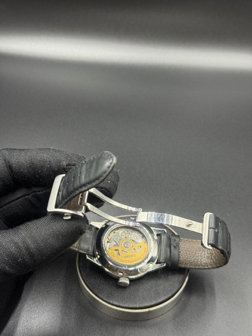 Seiko Presage Cocktail Time Automatic Watch (Category: Men's Watches) located in Manila. Submitted by cws.ph (Listing ID 1466250823, Image 3). Description: - Brand/Model: Seiko Presage Automatic - Dial: Textured silver sunburst with 3 o'clock date window - Movement: 4R35B automatic movement with 23 jewels (visible via exhibition case back) - Case & Crystal: Polished steel case with a clean, scratch-free crystal - Strap: Black leather strap equipp