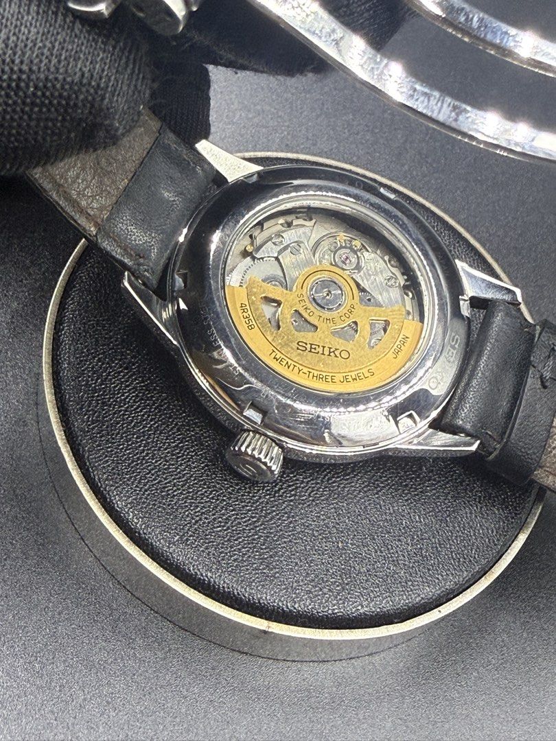 Seiko Presage Cocktail Time Automatic Watch (Category: Men's Watches) located in Manila. Submitted by cws.ph (Listing ID 1466250823, Image 2). Description: - Brand/Model: Seiko Presage Automatic - Dial: Textured silver sunburst with 3 o'clock date window - Movement: 4R35B automatic movement with 23 jewels (visible via exhibition case back) - Case & Crystal: Polished steel case with a clean, scratch-free crystal - Strap: Black leather strap equipp
