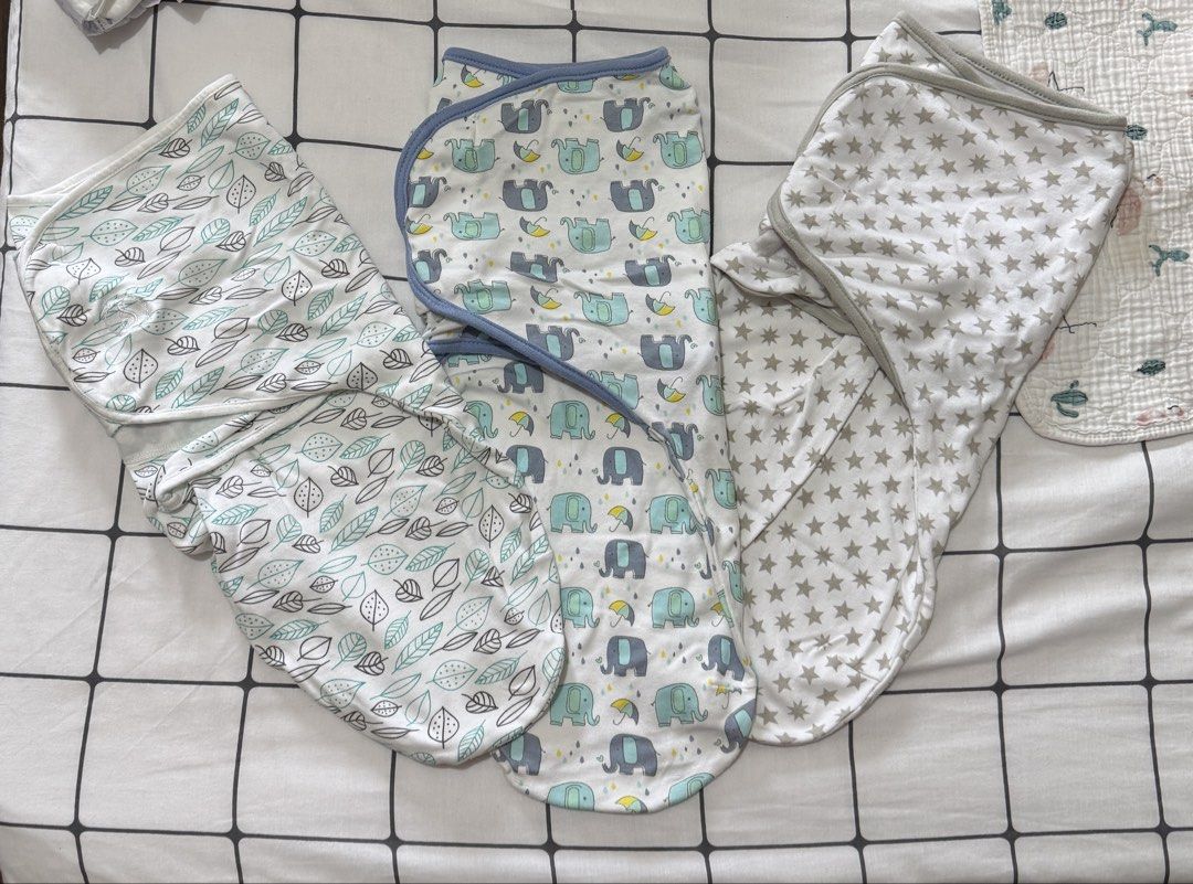Set of 3 infant swaddle blankets with different patterns (Category: Babies & Kids Fashion) located in Quezon City. Submitted by zaneniniads (Listing ID 1466229646, Image 1). Description: Set of three infant swaddle wraps. Includes grey star print, blue elephant pattern, and green leaf design. Easy Velcro-style secure tabs for snug wrapping. Soft cotton fabric, breathable for newborns. Machine washable. Ready for your little one..