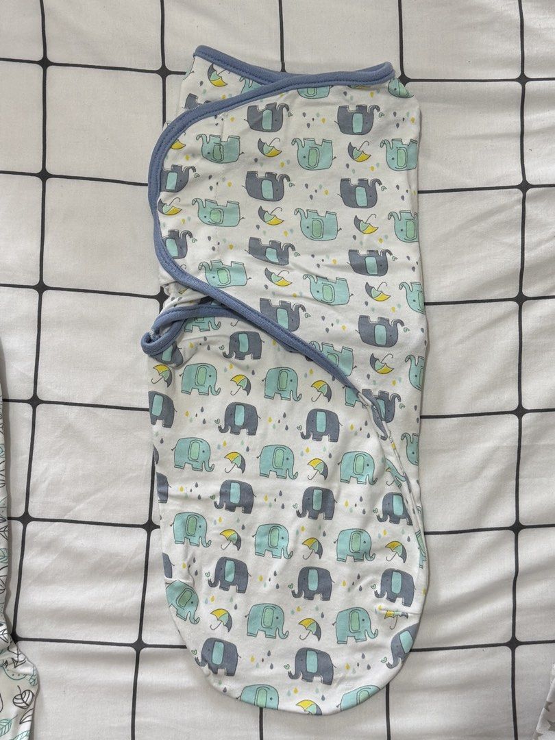 Set of 3 infant swaddle blankets with different patterns (Category: Babies & Kids Fashion) located in Quezon City. Submitted by zaneniniads (Listing ID 1466229646, Image 3). Description: Set of three infant swaddle wraps. Includes grey star print, blue elephant pattern, and green leaf design. Easy Velcro-style secure tabs for snug wrapping. Soft cotton fabric, breathable for newborns. Machine washable. Ready for your little one..
