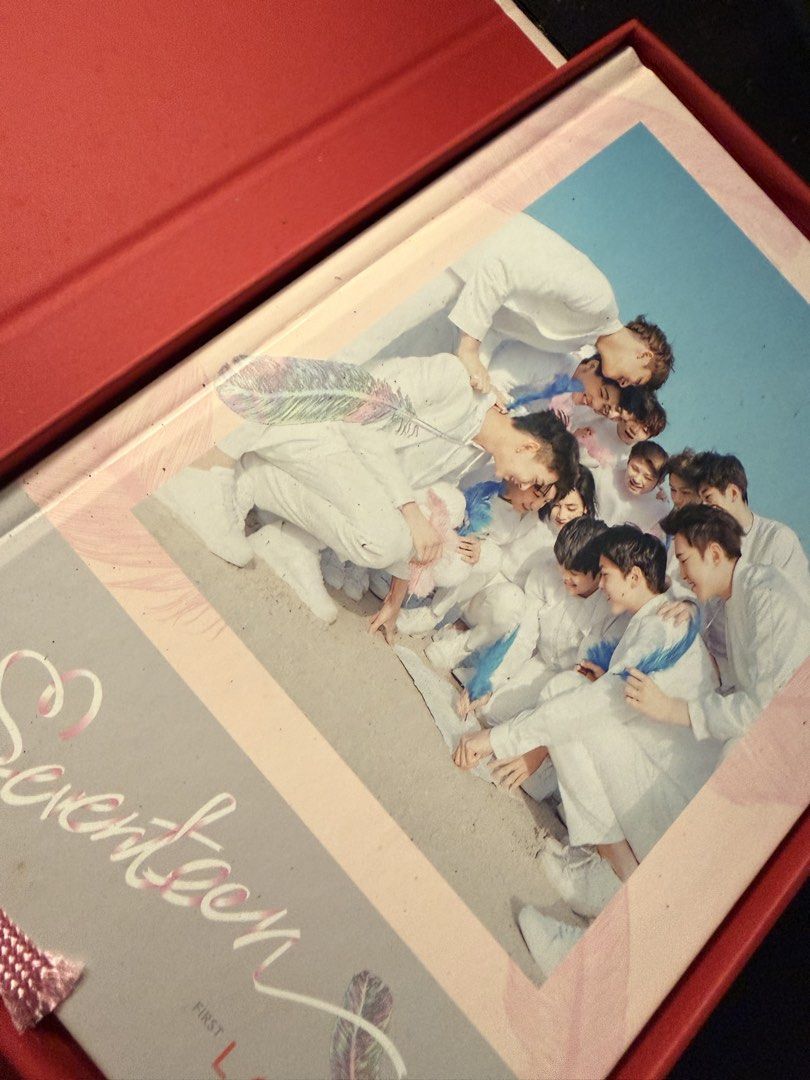 SEVENTEEN First Love Album (Category: K-Wave Merchandise) located in Antipolo. Submitted by chenilinn (Listing ID 1466273508, Image 3). Description: SEVENTEEN First Love physical album. Includes the red outer box, photobook, and CD in its red sleeve..