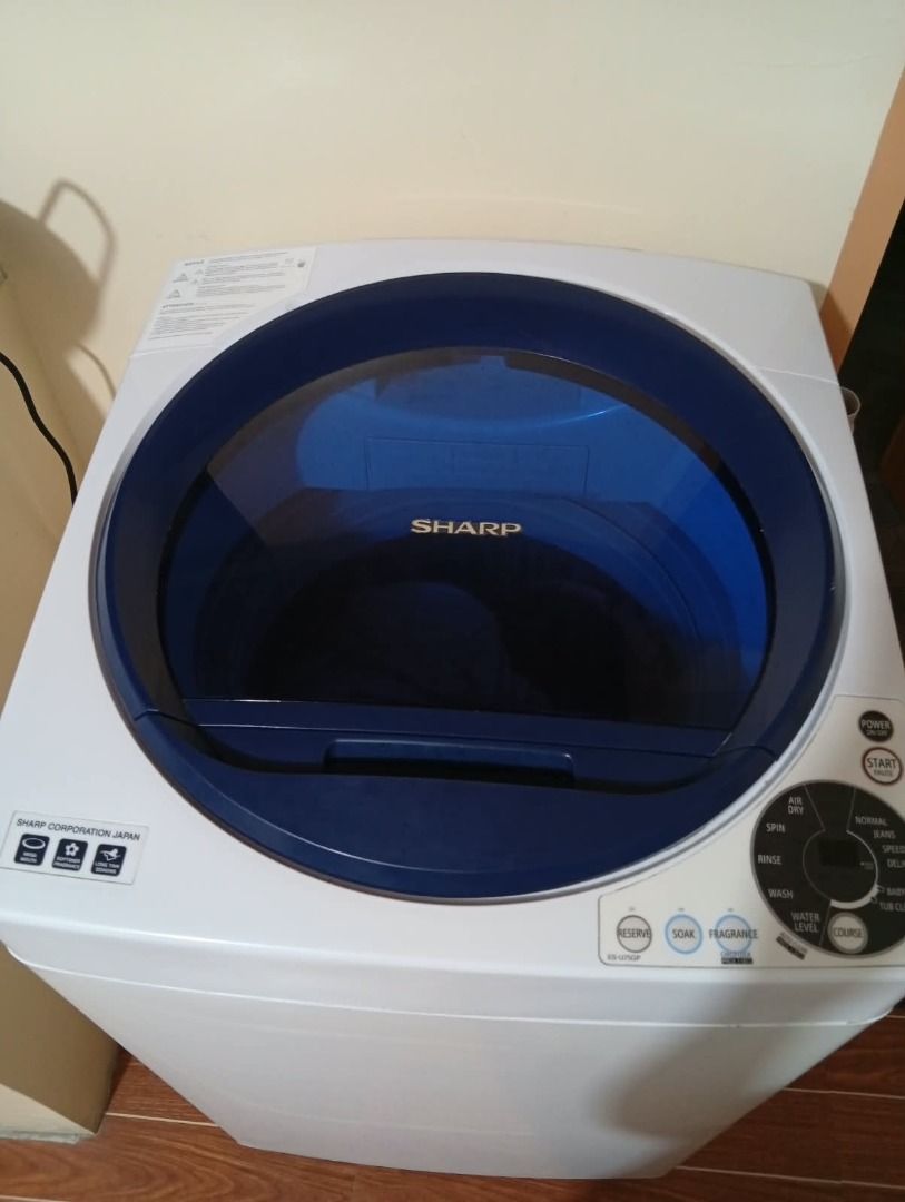 Sharp Top Load Washing Machine Blue White (Category: Washing Machines and Dryers) located in Caloocan City. Submitted by grandmountain_ca5a79 (Listing ID 1466162429, Image 1). Description: - Brand: Sharp Top Load Washing Machine - Color: Clean white with stylish deep blue lid - Features: Standard right-side control panel and convenient pull-out detergent dispenser drawer - Condition: Exterior body is clean with minimal wear; drum and blue pulsato