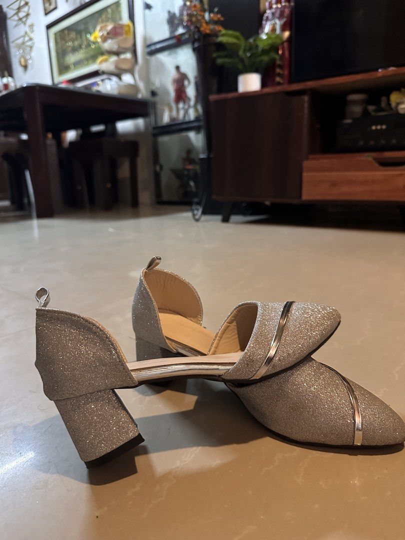 Silver Glitter Block Heels Size 40 (Category: Heels) located in Manila. Submitted by mysticdog_8e9243 (Listing ID 1466181535, Image 3). Description: - Size: 40 (marked on sole) - Color/Design: Silver glitter with metallic silver curved stripe - Heel: Comfortable low block heel - Toe: Pointed toe design - Style: Ankle strap cutout - Condition: Excellent, barely any wear with clean insides and soles.