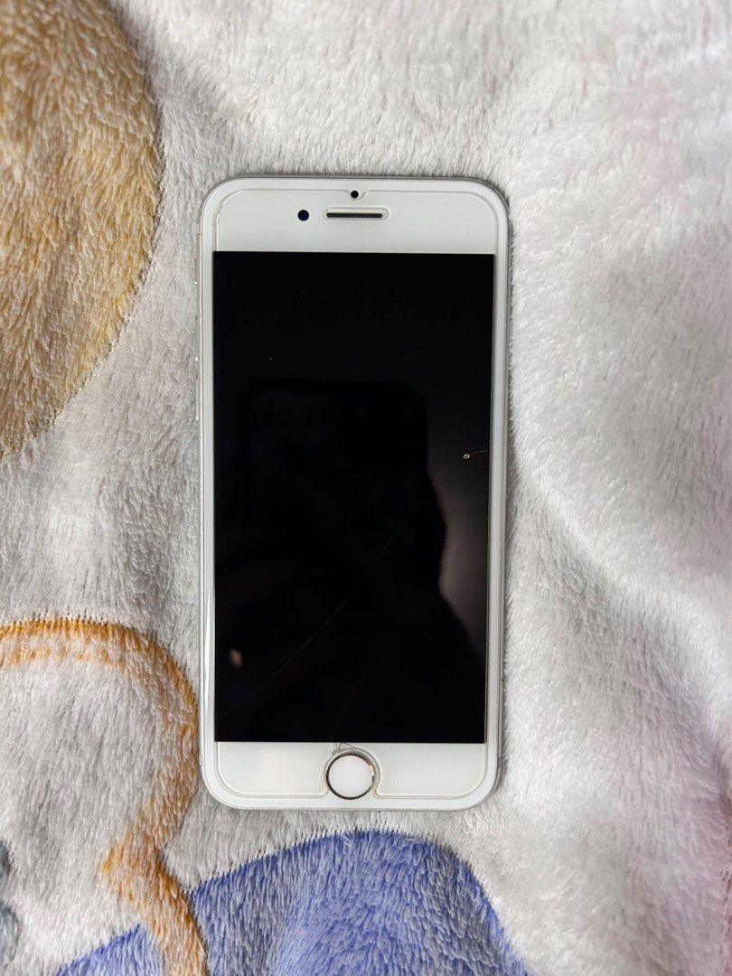 Silver iPhone 7 (Category: iPhone 7 Series) located in Quezon City. Submitted by kuromist (Listing ID 1466163598, Image 1). Description: Well-loved iPhone 7. Issues: - Replaced battery - Screen has a spot na.