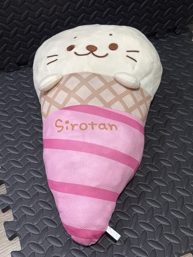 Sirotan Ice Cream Cone Plush Toy (Category: Plushies & Soft Toys) located in Cainta. Submitted by shopbyyna (Listing ID 1466261288, Image 1). Description: - Authentic Sirotan ice cream cone plush collectible - Features a cute white seal head on top with waffle cone and pink striped details - Made with soft, cooling fabric ideal for the PH summer weather - Sirotan logo delicately embroidered across the base - Perfect for kawaii plush collectors an