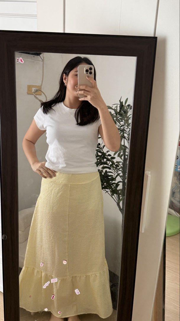 Skirt TAKE ALL (Category: Skirts) located in Makati City. Submitted by prelovedbyeth (Listing ID 1466331593, Image 2). Description: - Set of 2 skirts: 1 solid white tiered skirt with a flowy drape, and 1 yellow-and-white striped textured skirt - Length: Midi to maxi (depends on your height) - Styling: Easy to pair with basic white tees or tanks for casual days - Condition: Clean and ready to wear - Perfect addition to your everyday wardrobe!.