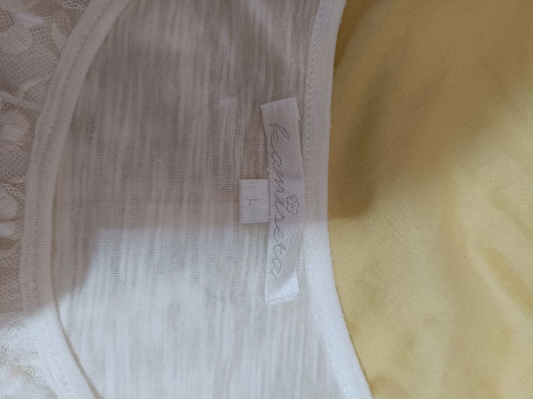 sleeve less (Category: Others Tops) located in Limay. Submitted by lisa_2318 (Listing ID 1466275410, Image 3). Description: white, layered lace tank top featuring a scoop neckline and floral lace ruffle tiers..