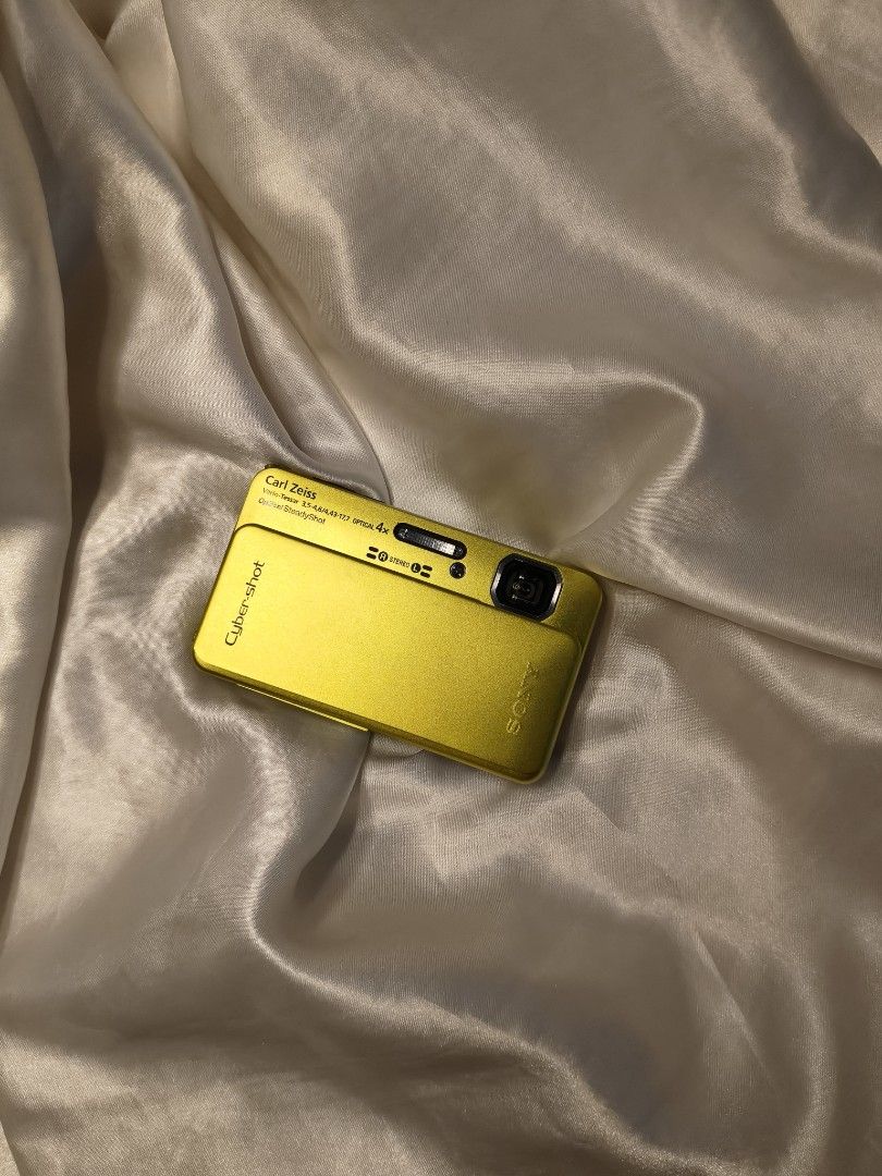Sony Cyber-shot DSC-TX10 Touchscreen Digital Camera (Category: Cameras) located in Cebu City. Submitted by suga.rcam (Listing ID 1466173165, Image 2). Description: - Model: Sony Cyber-shot TX10 (Bright Yellow)💛 - Condition: Tested and fully functional - Camera Specs: 16.2 MP Exmor R CMOS sensor, Carl Zeiss lens, Full HD video - Durability: Waterproof down to 5 meters - Design: Slim pocket design with sliding front lens cover - Display: Touch scr
