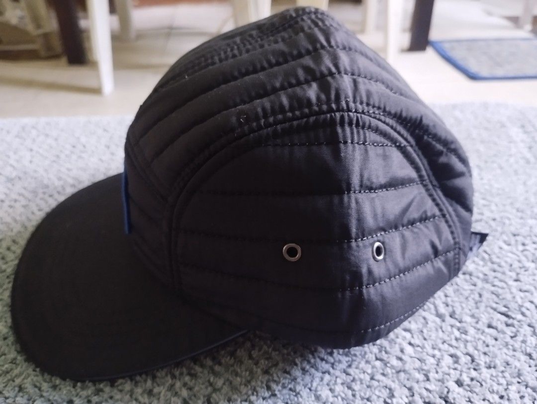 Spacecraft x Dru Bru Quilted Black Camp Hat (Category: Caps & Hats) located in Manila. Submitted by happycaps (Listing ID 1466179026, Image 2). Description: - Brand: Spacecraft x Dru Bru collaboration - Style: Black quilted 5-panel hat with flat brim - Details: Bold front patch logo, metal side eyelets, interior branded graphics - Fit: Adjustable strapback closure with plastic buckle - Condition: Clean condition throughout.