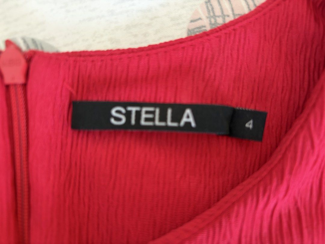 STELLA Red Sleeveless Dress Size 4 (Category: Dresses) located in Quezon City. Submitted by makingroomfinds (Listing ID 1466181749, Image 2). Description: - Brand: Stella - Color: Bright red - Size: 4 - Material: Textured fabric - Design: Sleeveless with a fitted waist and classic knee-length cut - Closure: Back zipper - Condition: Great, super simple to dress up or down.
