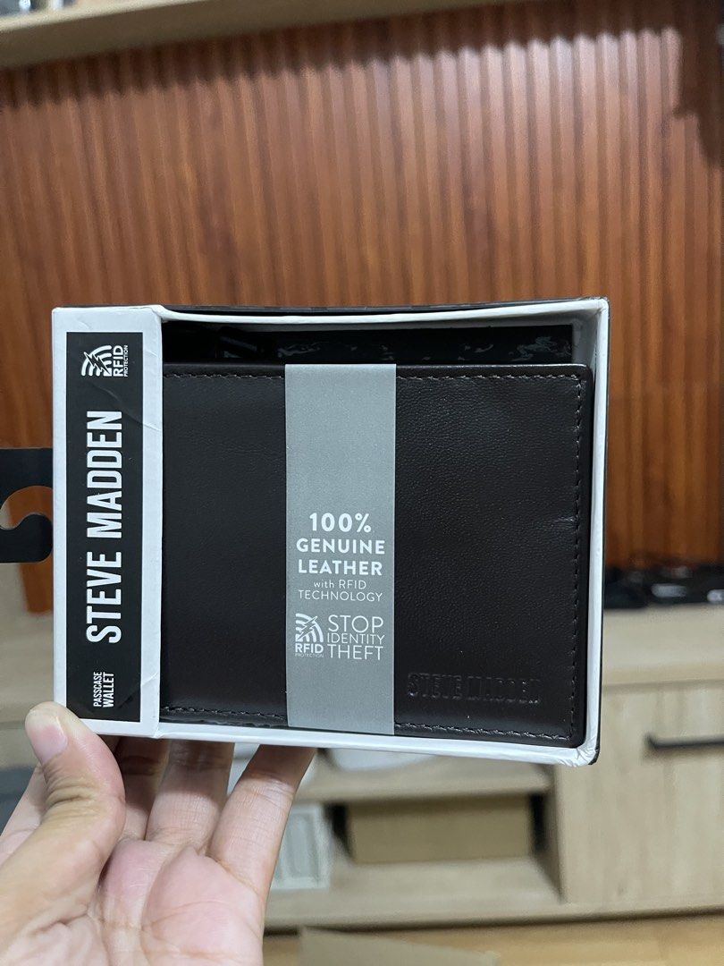 Steve Madden Passcase Wallet Brown Leather (Category: Wallets & Card holders) located in Manila. Submitted by jvlni (Listing ID 1466334016, Image 2). Description: - Brand: Steve Madden - Style: Men's Passcase Wallet - Color: Brown - Material: 100% Genuine Leather - Security: Built-in RFID blocking technology to prevent identity theft - Condition: Brand new, comes with original box and tags fully intact.