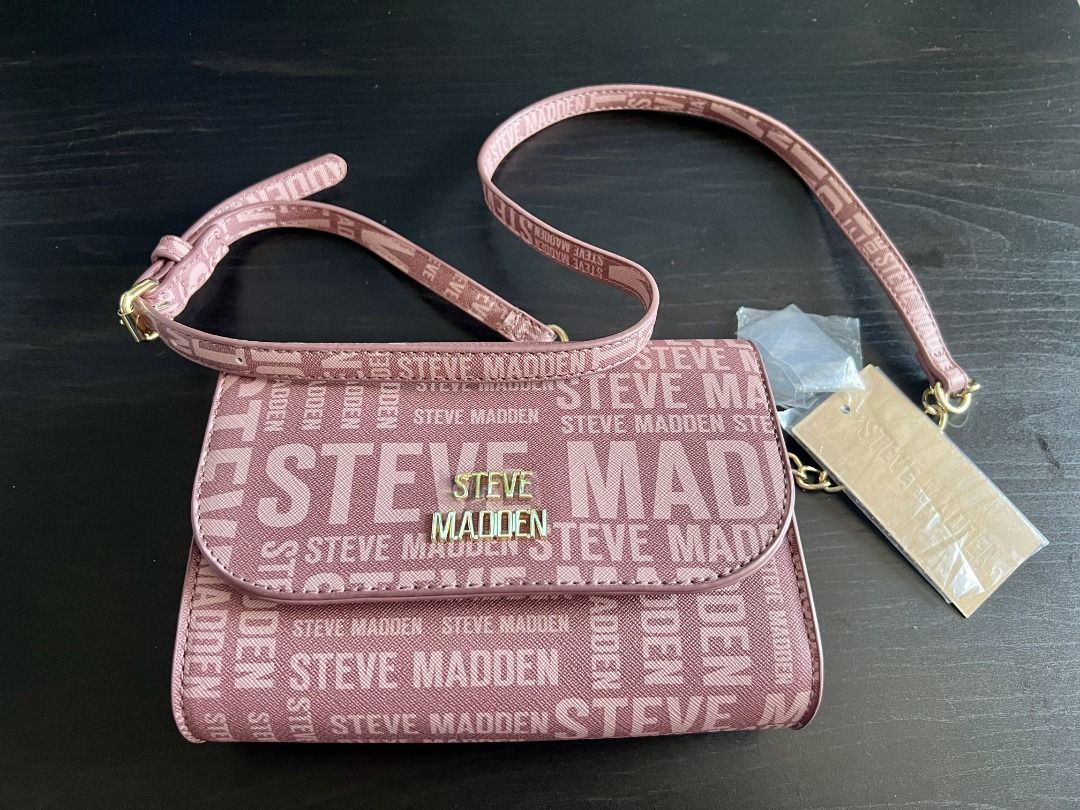 Steve Madden Pink Monogram Crossbody Bag (Category: Cross-body Bags) located in Mandaluyong City. Submitted by joquer (Listing ID 1466194265, Image 1). Description: Brand new Steve Madden crossbody / wallet-on-chain style bag in dusty rose (mauve pink) with all-over “STEVE MADDEN” logo print. Features gold-tone logo hardware on the flap, adjustable logo-print shoulder strap, and multiple interior compartments (including zippered pockets and card 