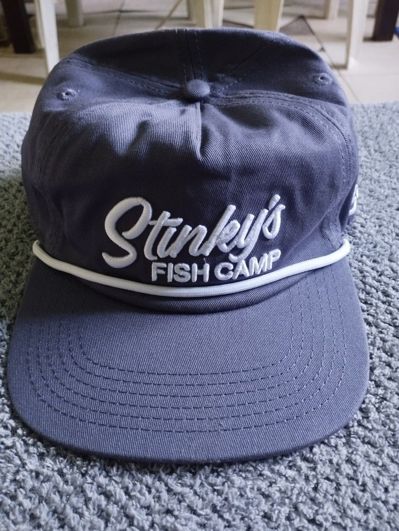 Stinky's Fish Camp 30A Rope Snapback Cap Grey (Category: Caps & Hats) located in Manila. Submitted by happycaps (Listing ID 1466179929, Image 1). Description: - Brand/Source: Stinky's Fish Camp - Color: Grey with a stylish white rope across the brim - Details: Embroidered front lettering and '30A' on the side - Closure: Adjustable white plastic snapback strap - Condition: Includes original interior tag inside the crown.