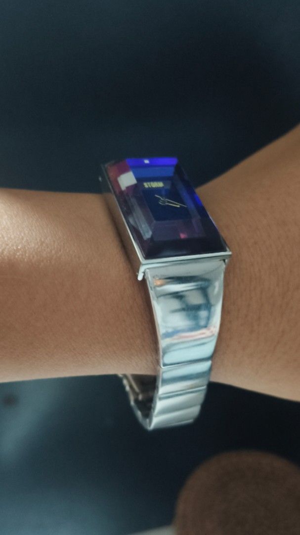 Storm London Blue Crystal Rectangular Watch (Category: Women's Watches) located in Taguig. Submitted by mercyeugen28914 (Listing ID 1466298572, Image 2). Description: - Brand: Storm London - Dial: Striking blue faceted crystal face with minimal silver hands and logo - Case & Strap: Rectangular silver-tone metal case with a linked stainless steel bracelet - Design: Futuristic style that catches the light from every angle - Fit: Comfortable and adj